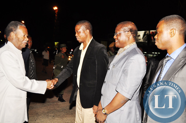 President Sata greeting Defence Minister Edgar Lungu