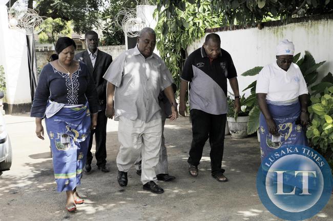 President Banda arrives at the funeral house. On the right is the late Dennis Liwewe's son Ponga.
