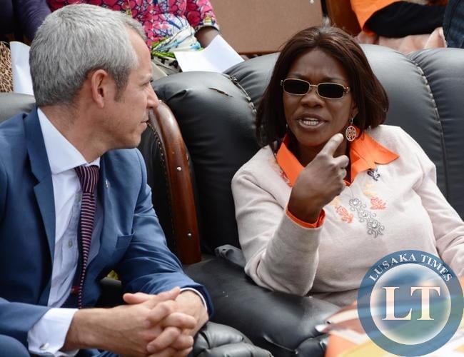 Chongwe Member of Parliament Sylvia Masebo speaking to Deputy Head of DFID British High Commission Malcolm Geere shortly before Hon. Masebo delivered her speech during the civil society for scaling up nutrition global day of action in at Katuba primary school