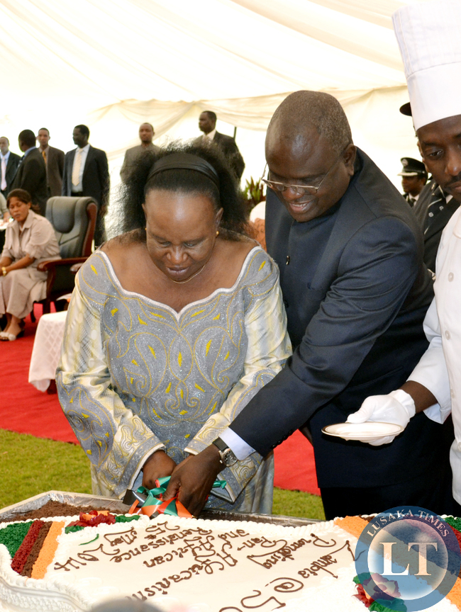 Acting Chief Justice Lombe Chibesakunda and Speaker of the National Assembly Patrick Matibini cut a cake on behalf of President Michael Sata during the commemoration of the Africa Freedom Day at State House