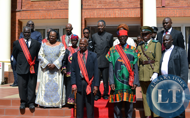 President Michael Sata poses for a group photograph with those honoured during the investiture ceremony at State House in Lusaka on Sunday