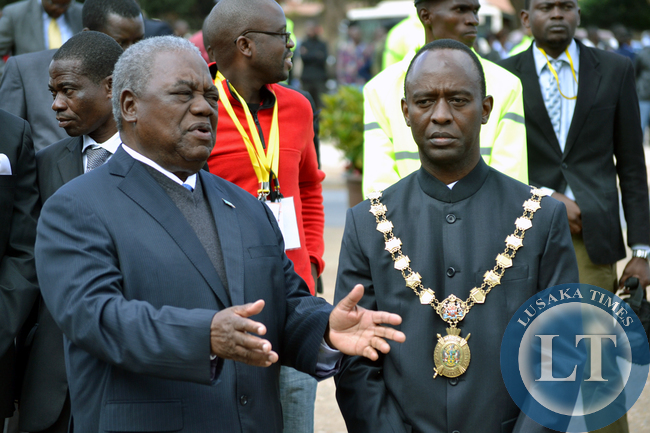 Former President Rupiah Banda talks to Lusaka Mayor Mulenga Sata at the freedom statue