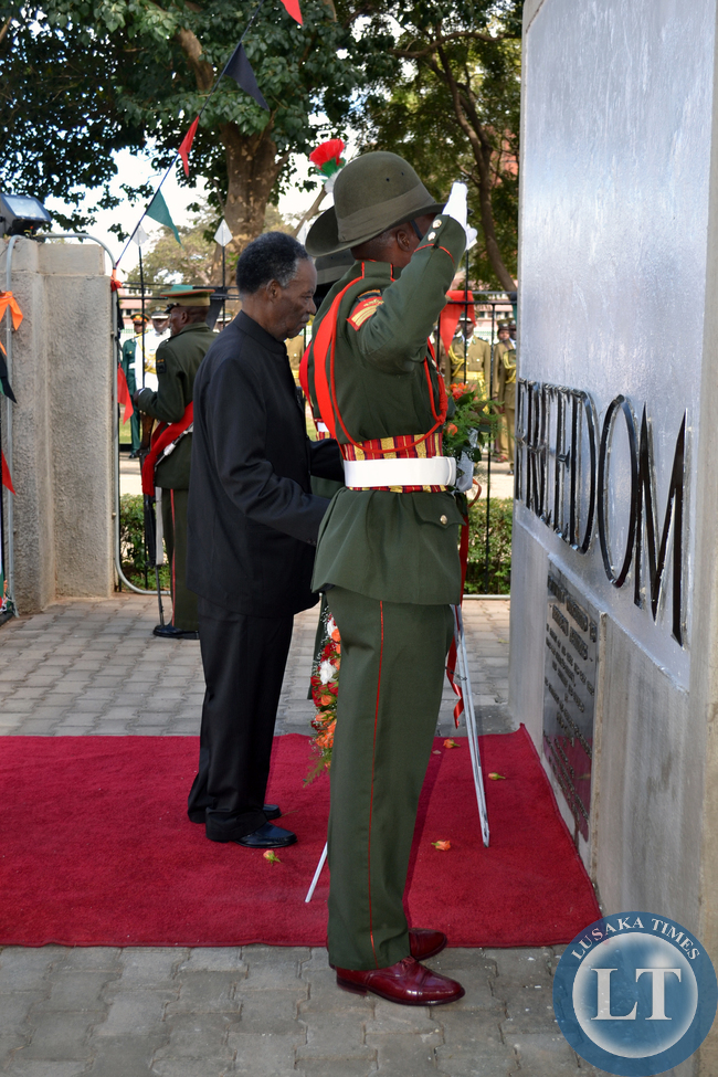 President Michael Sata lays a wreath at the freedom statue in Lusaka.