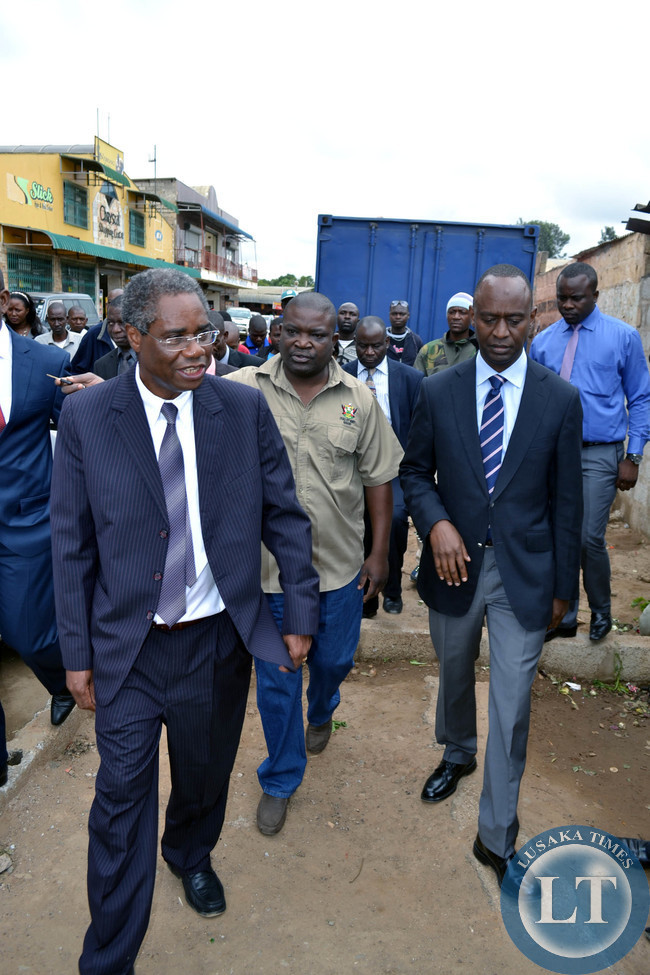 Local Government Minister Emmanuel Chenda (left) and Lusaka Mayor Mulenga Sata inspect a market near Northmead shopping centre