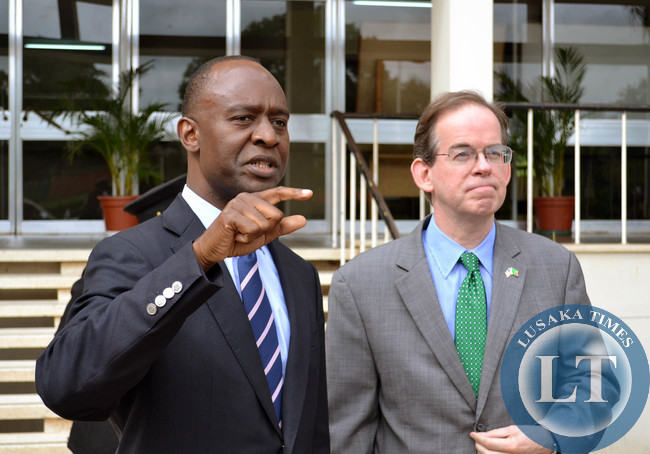 Lusaka Mayor Mulenga Sata (left) talks to American Embassy Chargé d'Affaires David Young at Lusaka Civic centre before the two led separate delegations to inspect drainage systems and markets