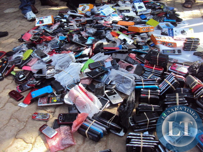 Counterfeit Samsung branded phones valued at K867,000 intercepted in a joint operation of the Zambia Police service and the Cycorps Zambia Limited being displayed at the freedom stature yesterday during the World Intellectual Property day held at the Freedom statue under the theme "MOVIES A GLOBAL PASSION "