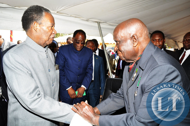 President Sata greets First Republican president Dr Kenneth Kaunda on arrival for the commemoration of International Labour Day at the Freedom Statue in Lusaka on May 1,2014 -Picture by THOMAS NSAMA