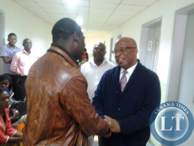 Dr Mumba greets ZCTU President Leonard Hikaumba who is nursing his sick father at Levy Mwanawsa