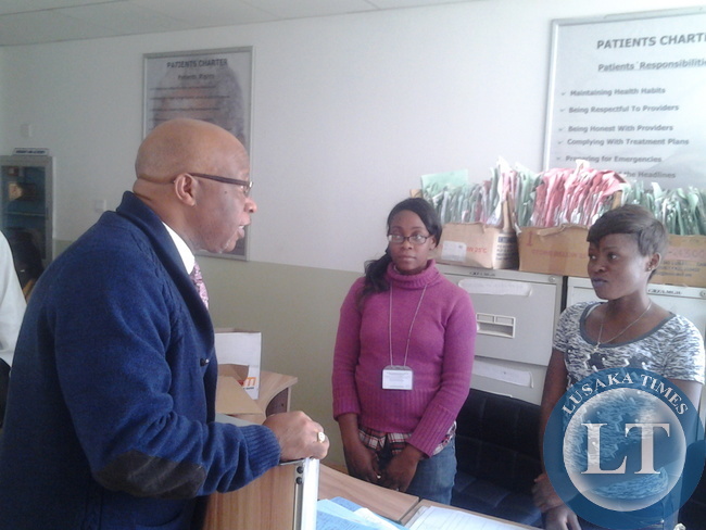 Dr Mumba takes time to chat with members of staff at Levy Mwanawasa Hospital
