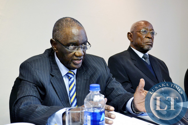 Former freedom fighter Sikota Wina (left) addresses journalists at Inter-Continental hotel in Lusaka yesterday as fellow former freedom fighters Lewis Changufu and Aaron Milner look on