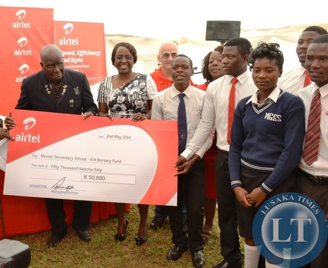 First Republican President Kenneth Kaunda and Airtel Zambia managing director Charity Lumpa making an official handover of K50,000 to 50 pupils during the launch of the KK-Airtel Bursary fund at Munali Secondary School in Lusaka