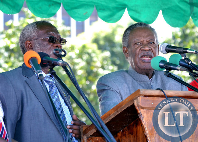 President Michael Sata (right) addresses workers as Labour Minister Fackson Shamenda looks on at Labour Day celebrations in Lusaka
