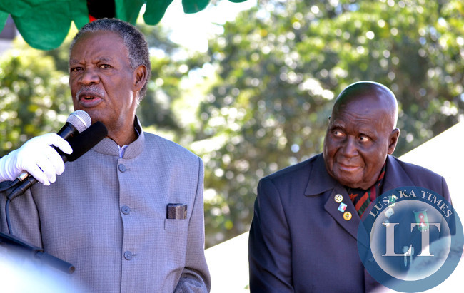 President Michael Sata (left) addresses workers as First Republican President Dr Kenneth Kaunda looks on at Labour Day celebrations in Lusaka