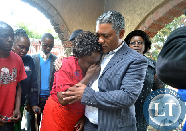 Kabwata Member of Parliament Given Lubinda consoles Chilenje ward eight councillor Maggy Zulu who was overcome with grief when the parliamentarian visited a house in Chalala township where a woman died after the structure caught fire in Lusaka recently