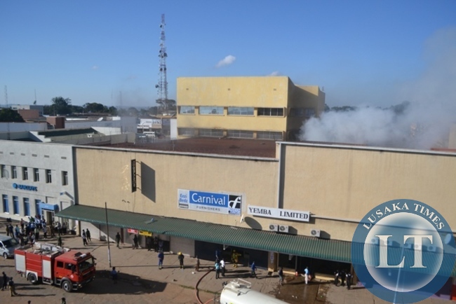 FIRE fighters quenching the inferno that gutted Yemba building complex in Kitwe