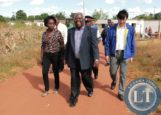 Northern Province Minister Freedom Sikazwe with Mapalo Day Care Centre Director Chanda Chintu and TBEA Commercial Manager Author Liu during the inspection of the Centre in Kasama today . This was before he presented an assortment of goods worth K50 donated by TBEA