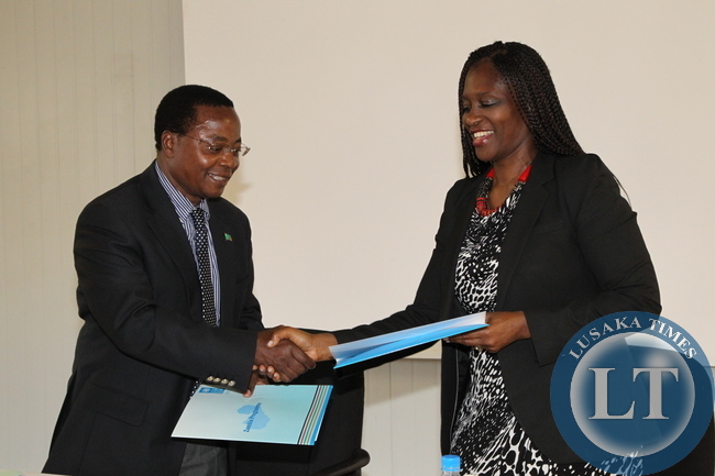 Health Permanent Secretary,Dr.Davy Chikamata and United Nation Development Programme Country Director, Viola Morgan cut the ribbon during the donation of Six Land Cruisers and one Hilux double cap valued at US$281,750 to the Ministry of Health