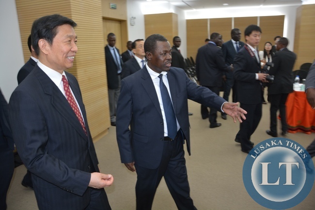 Justice Minister Wynter Kabimba ushers in the Vice President of China Mr. Li Yuanchao during the bilateral meeting at Government Complex
