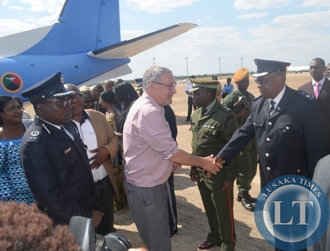 Vice President Guy Scott (middle) greetings defence and security upon his arrival at Harry Mwaanga Nkumbula International Airport in Livingstone