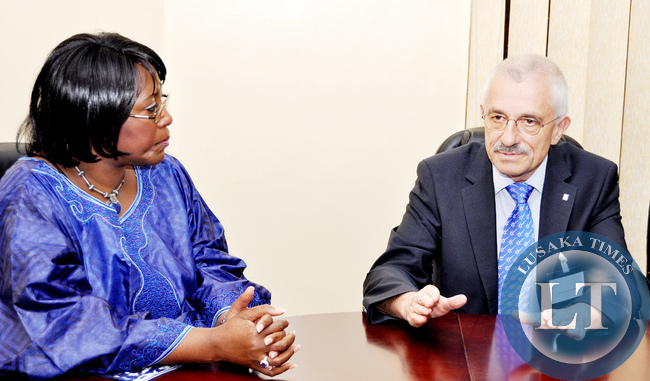 First Lady Dr Christine Kaseba listens to Regional Teaching Course in Neurology director Prof Erich Schmutzhard shortly before she officially opened the sixth Regional Teaching Course in Neurology at UTH on June 19,2014 -Picture by THOMAS NSAMA