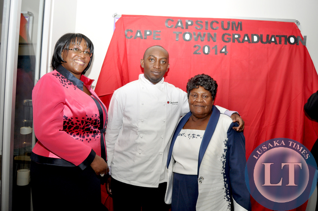 FILE: Late President Michael Sata's son Mwango (c) with mother Dr Christine Kaseba and grand mother Loyce Kaseba (r) after his Chef management programme graduation ceremony at Capsicum Cape Town Campus in South Africa on June 11, 2014 -Picture by THOMAS NSAMA