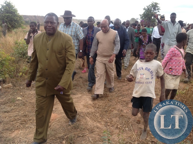 Dr Nevers Mumba walks with the stranded residents
