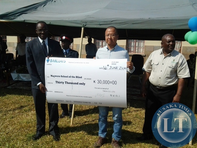 Eastern Province Permanent Secretary Dr Chileshe Mulenga, TBEA Deputy Project Manager Meng Lei and ZESCO regional manager Yobe Mukonka holding a dummy cheque of Magwero School of the Blind in Chipata yesterday.The K30,000 was donated to the school as part of commemoration on African Day Eastern Province Permanent Secretary Dr Chileshe Mulenga, TBEA Deputy Project Manager Meng Lei and ZESCO regional manager Yobe Mukonka holding a dummy cheque of Magwero School of the Blind in Chipata yesterday.The K30,000 was donated to the school as part of commemoration on African Day