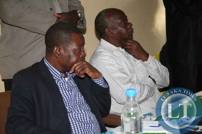 PATRIOTIC Front Secretary General, Wynter Kabimba and Eastern Province Interim Party Chairperson, Lameck Mangani, listen to questions from party members during a meeting at Luangwa House in Chipata
