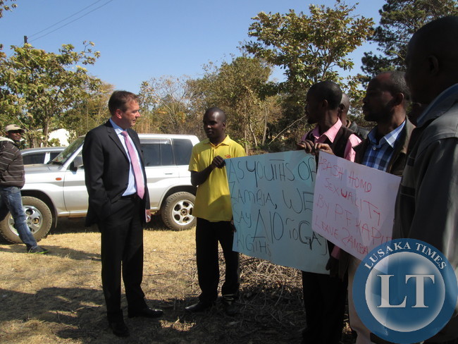 Germany Ambassador to Zambia Bernd Finke to part of youths who had displayed placards denouncing homosexuality outside Kapiri mposhi court