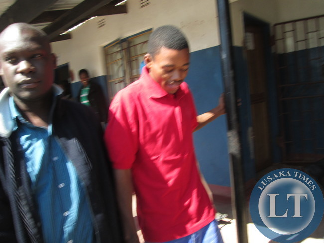Acquitted James Mwape with a relative outside court
