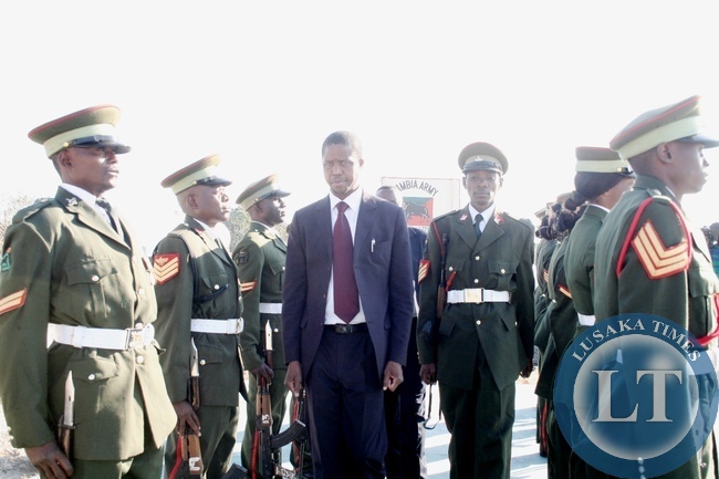 Defense Minister Edgar Lungu inspects the Quarter Guard mounted by Zambia Army Western Region Headquarters during an Official visit in Mongu District, Western Province