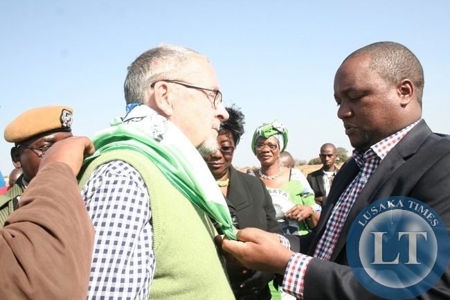 Matero MP Miles Sampa (r) dresses Vice President Dr. Guy Scott (l) a PF scarf on arrival at Kaoma air strip to drum up support ahead of the forthcoming Mangango August 19 2014, Parliamentary bye elections in Kaoma District, Western Province,