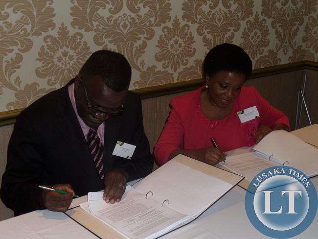 ENVIROBOARD Corporation Zambia Limited Chairman, Vincent Chakulya (left) and Africapaciti Group Chairperson signing the joint venture.