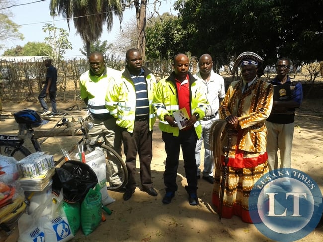 Senior Chief Ishindi of the Lunda speaking of Zambezi District in North-western Province with Road Transport and Safety Agency (RTSA) Chief Executive Officer Zindaba Soko (center) with some company officials shorty after a meeting at his palace on Friday last week
