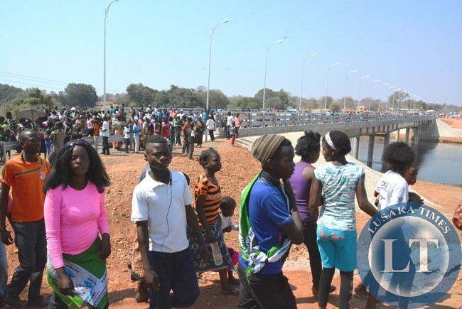 Residents nearby areas of Chiawa and Chirundu joyfully cross the newly commissioner Michael Chilufya Sata Bridge in Chiawa