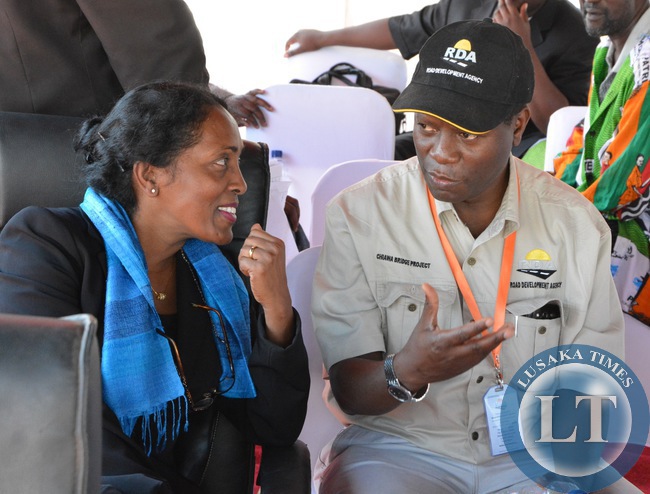 RDA Chief Executive Officer Barnard Chiwala speaks to World Bank Country Representative Kaundhavi Kadiresan during the commissioning of the new Michael Chilufya Sata Bridge in Chiawa