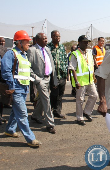 Avic International Deputy Director Liu Xiaodong (left) takes Finance Minister Alexander Chikwanda (second from left), Local Government and Housing Minister Emmanuel Chenda and Road Development Agency Director General Bernard Chiwala on an inspection of one of the roads under construction in Lusaka