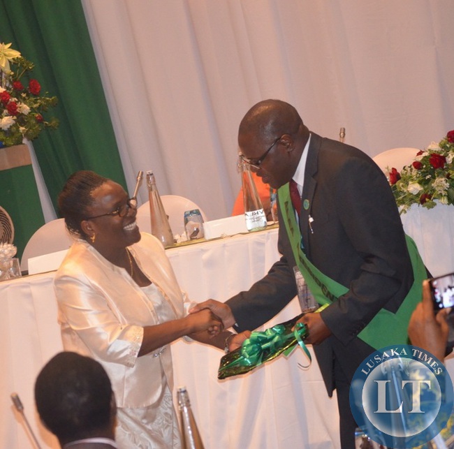 Outgoing AEAA president Joyce Ndalichako (left) crowning incoming AEAA president Michael Chilala (right) during the closing ceremony of the annual conference at Zambezi Sun Hotel in Livingstone