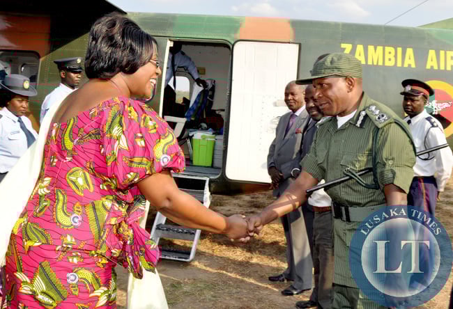 First Lady Dr Christine Kaseba bids farewell to Muchinga Province deputy commissioner of Police Bonnie Kapeso short before departure for Lusaka on August 15,2014. -Picture by THOMAS NSAMA