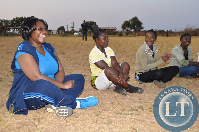 First Lady Dr Christine Kaseba with Pupils during the Physical education Session at the on-going First Lady's Mentorship training of Teachers/ Community Leaders and Pupils at Chinsali Girls Secondary school grounds on August 14, 2014 -Picture by THOMAS NSAMA