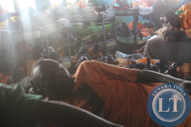 Prisoners demonstrating how there sleep in a room meant for 40 people but it has over 140