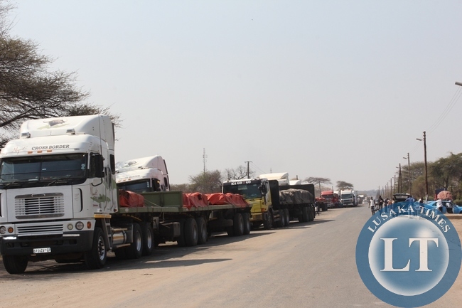 Above, trucks from Democratic Republic of Congo (DRC) heading to South Africa mostly carrying copper are stranded at Kazungula border post in Southern Proviince as authorities from Botswana site are not allowing due to enter their country fears of Ebola in DRC. Some drivers are now planning to back to Livingstone and try to use the Victoria Falls border post on the Zimbabwe route to South Africa