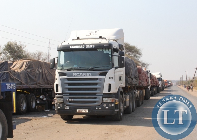 Above, trucks from Democratic Republic of Congo (DRC) heading to South Africa mostly carrying copper are stranded at Kazungula border post in Southern Proviince as authorities from Botswana site are not allowing due to enter their country fears of Ebola in DRC. Some drivers are now planning to back to Livingstone and try to use the Victoria Falls border post on the Zimbabwe route to South Africa