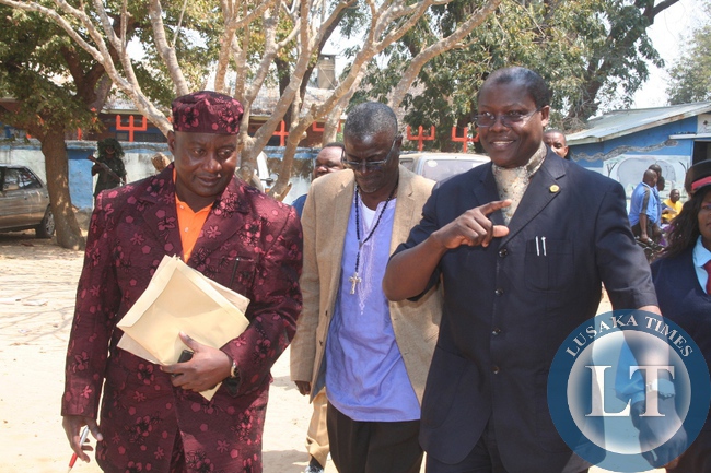 HOME Affairs minister Dr Ngosa Simbyakula (right) talks to National chairman general for Lunda Lubanza traditional ceremony Brig.Gen Kenneth Kankinza (left) as Agricultural and Livestock permanent secretary Dr David Shamulenge (centre) looks on during this year’s celebration of Lunda Lubanza traditional ceremony in Zambezi on Saturday.
