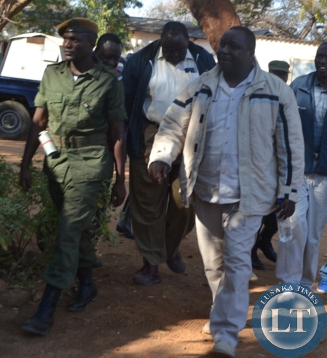 Jonas Shakafuswa being led by Police officers to court