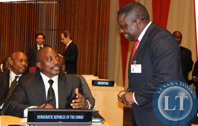 Zambia Foreign Minister Harry Kalaba (RIGHT) chats with Democratic Republic of Congo President Joseph Kabila at UN Headquarters on Monday 22-09-2014. PHOTO | CHIBAULA D. SILWAMBA | ZAMBIA UN MISSION