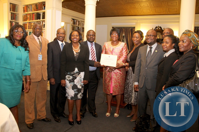 First Lady Dr Christine Kaseba with the International Telecommunication Union Secretary General Dr Hamadoun Toure and some Zambian at Yale Club Library where she was inaugurated as the ITU special Envoy for e-Health. This was on the sidelines of the 69th UN General Assembly in New York on September 21,2014 –Picture by THOMAS NSAMA