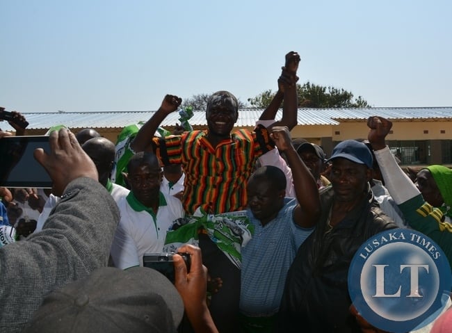 Davis Chisopa being air lifted by party officials to celebrate his victory after scooping the Mkushi south bye election.