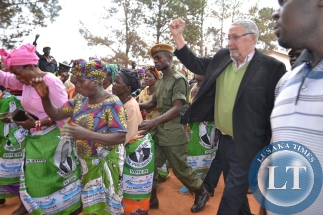 VICE-PRESIDENT Guy Scott raises PF symbol to the cheering crowd upon arrival at Kyafukum Primary School grounds for a rally to drum support for PF candidate Newton Malwa VICE-PRESIDENT Guy Scott raises PF symbol to the cheering crowd upon arrival at Kyafukum Primary School grounds for a rally to drum support for PF candidate Newton Malwa