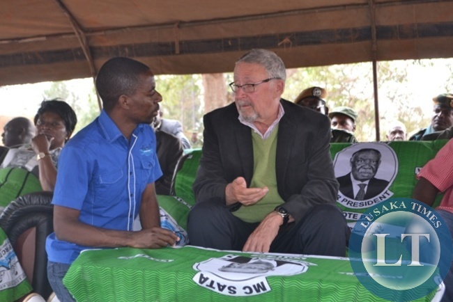 VICE-PRESIDENT Guy Scott chatting with PF Mufumbwe Member of Parliament Stephen Masumba before addressing a rally at Kyafukuma Primary School grounds in Solwezi Central to drum support for PF candidate Newton Malwa
